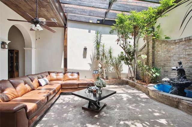 unfurnished living room featuring ceiling fan