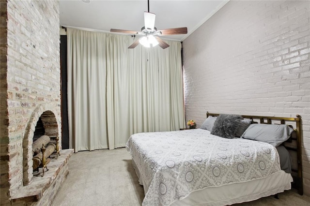 carpeted bedroom featuring ceiling fan, brick wall, and crown molding