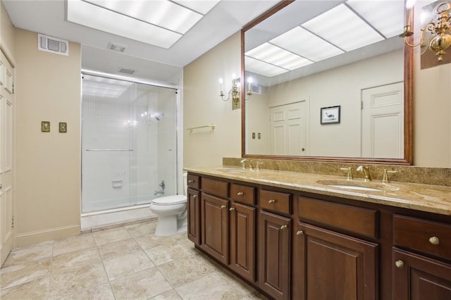 bathroom with vanity, toilet, an enclosed shower, and tile patterned floors