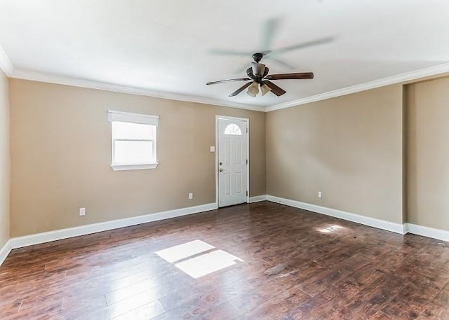 foyer with ceiling fan, dark hardwood / wood-style floors, and crown molding