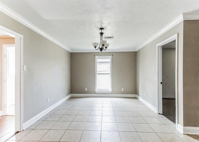 tiled empty room featuring an inviting chandelier and crown molding