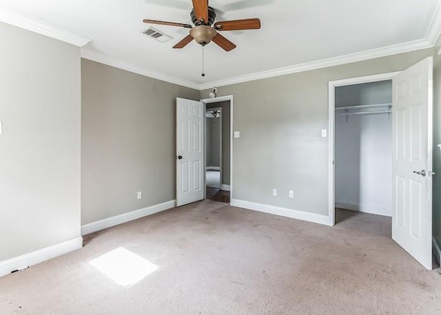 unfurnished bedroom featuring ceiling fan, light carpet, and crown molding