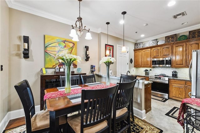 dining area featuring crown molding and a notable chandelier