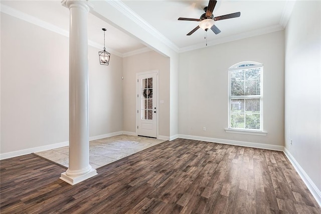 entrance foyer with ornate columns, light hardwood / wood-style flooring, and ornamental molding