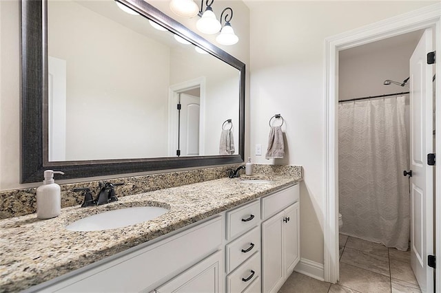 bathroom featuring tile patterned flooring, vanity, toilet, and a shower with shower curtain