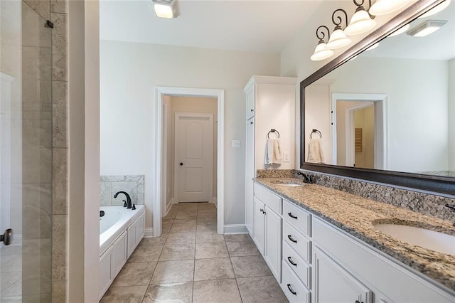 bathroom with tile patterned flooring, vanity, and shower with separate bathtub