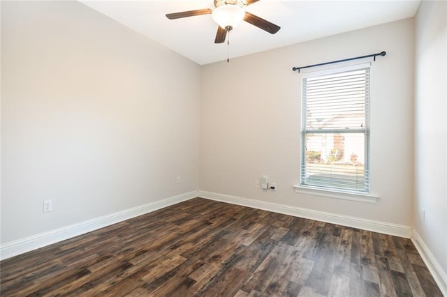 empty room featuring ceiling fan and dark hardwood / wood-style flooring