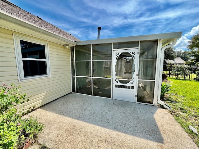 view of patio / terrace featuring a sunroom