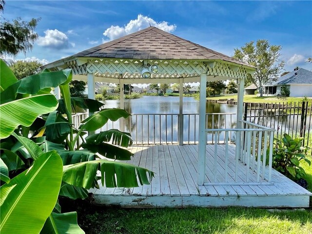 deck featuring a gazebo and a water view