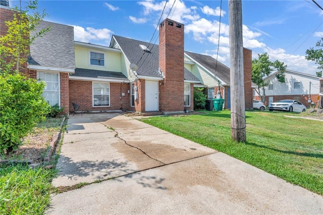 view of front of house with a front lawn