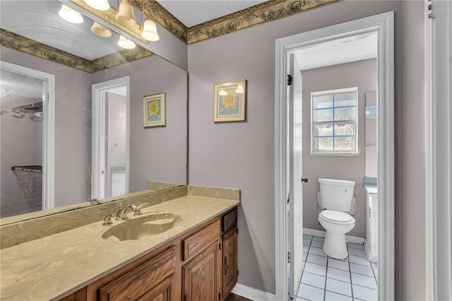 bathroom featuring vanity, toilet, and tile patterned floors