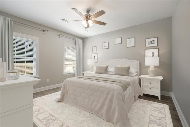 bedroom with hardwood / wood-style flooring and ceiling fan