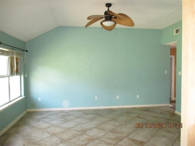 spare room with lofted ceiling and ceiling fan