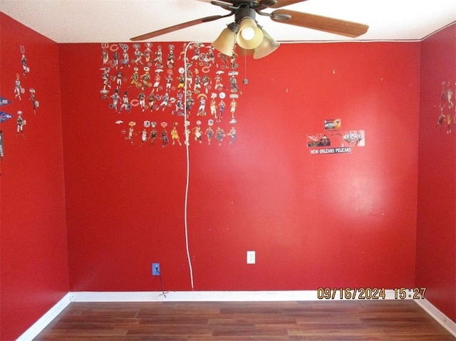 spare room with wood-type flooring and ceiling fan