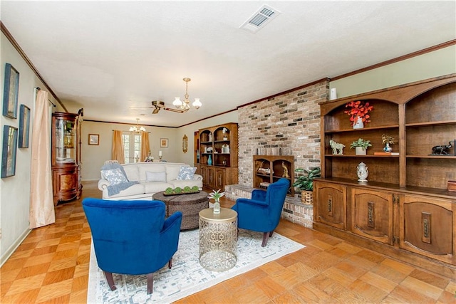 living room featuring a brick fireplace, a chandelier, light parquet flooring, and crown molding