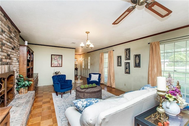 living room featuring ceiling fan with notable chandelier, a fireplace, ornamental molding, and light parquet floors