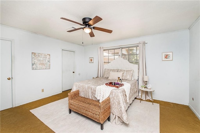 bedroom with carpet, crown molding, and ceiling fan