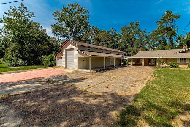 exterior space with a yard and a carport