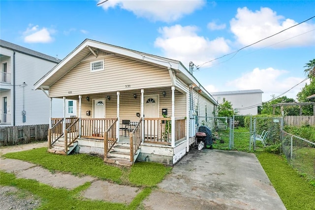 531-33 S Murat St, New Orleans, LA 70119 - view of front of home with covered porch, a gate, and fence