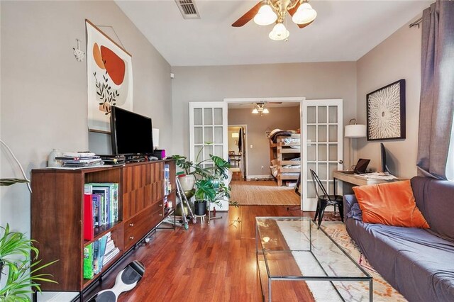 531-33 S Murat St, New Orleans, LA 70119 - living room featuring visible vents, wood finished floors, french doors, and a ceiling fan