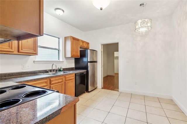 531-33 S Murat St, New Orleans, LA 70119 - kitchen with a sink, freestanding refrigerator, hanging light fixtures, black dishwasher, and dark countertops