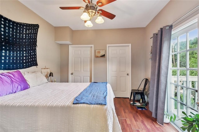 bedroom with wood-type flooring and ceiling fan