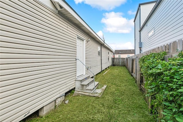 531-33 S Murat St, New Orleans, LA 70119 - view of home's exterior with a fenced backyard, a yard, and entry steps