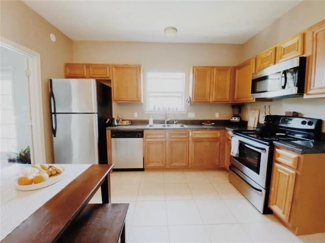 531-33 S Murat St, New Orleans, LA 70119 - kitchen with a sink, dark countertops, appliances with stainless steel finishes, and a wealth of natural light
