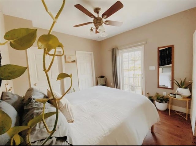 bedroom with wood-type flooring and ceiling fan