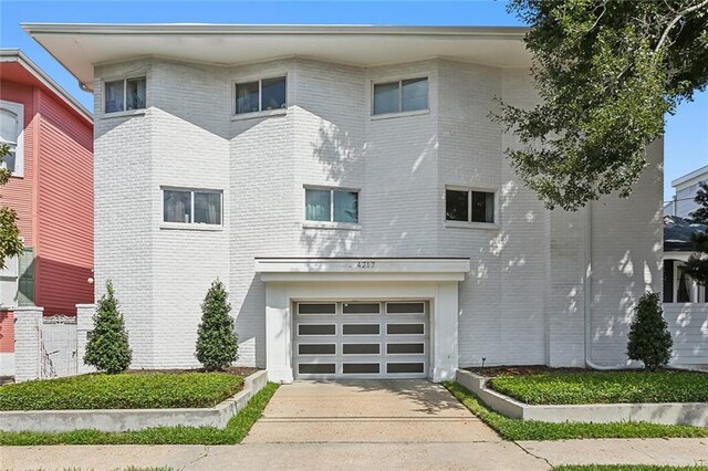 view of front of property with a garage