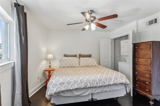 bedroom with ceiling fan and dark hardwood / wood-style floors