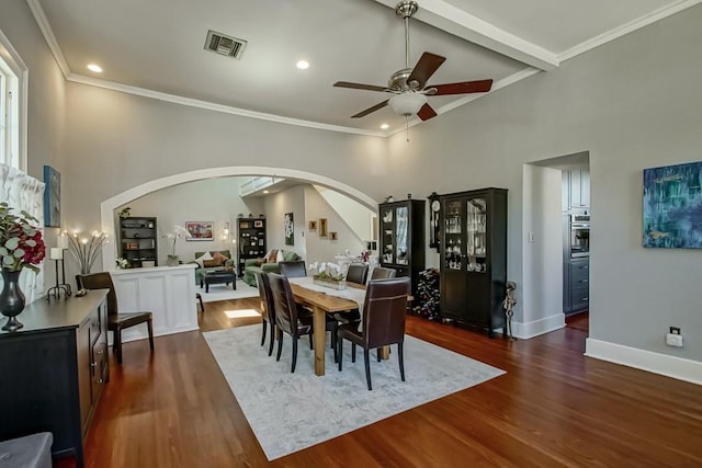 dining room featuring ceiling fan, crown molding, and dark hardwood / wood-style floors