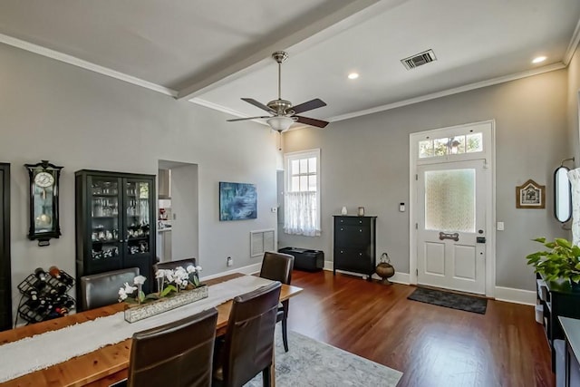 foyer entrance with beamed ceiling, ceiling fan, dark hardwood / wood-style flooring, and ornamental molding