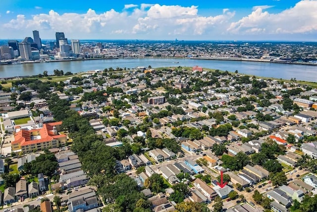 birds eye view of property with a water view