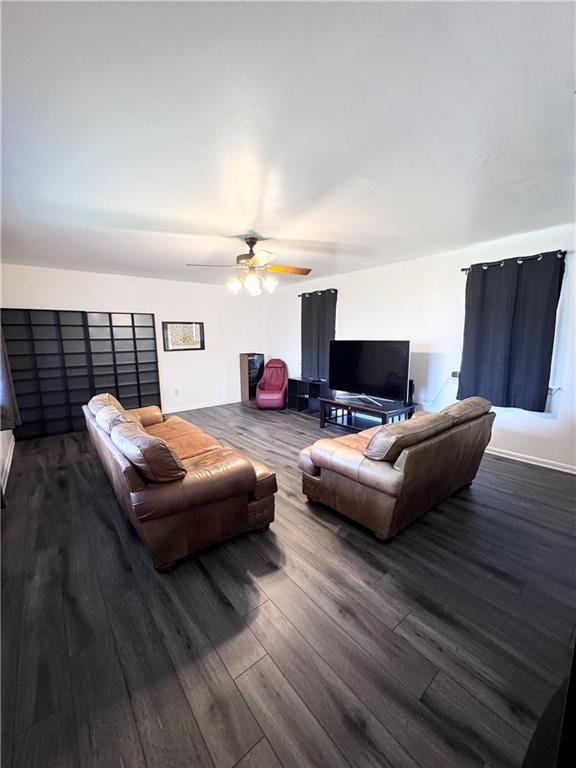 living room featuring ceiling fan and hardwood / wood-style floors