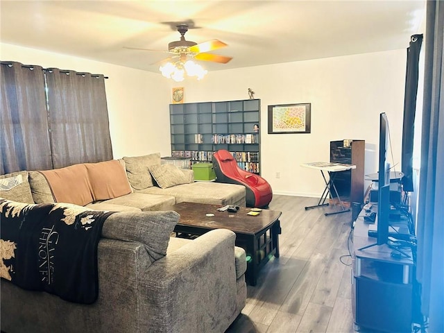 living room with ceiling fan and hardwood / wood-style flooring