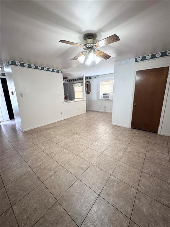 tiled empty room with cooling unit and ceiling fan