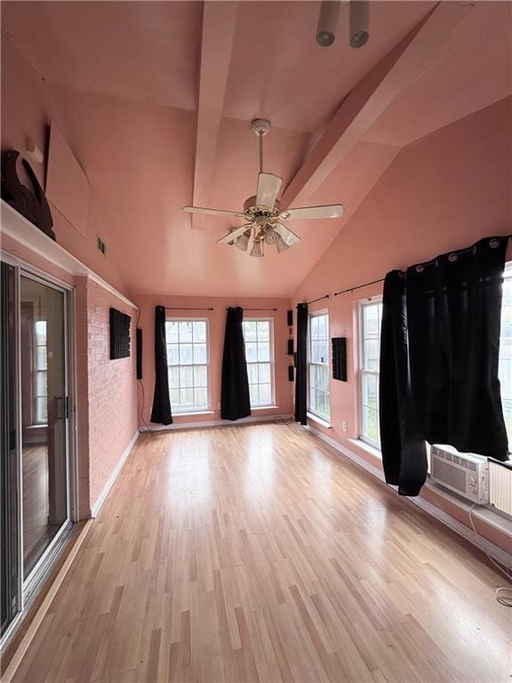 unfurnished living room featuring ceiling fan, high vaulted ceiling, and light wood-type flooring