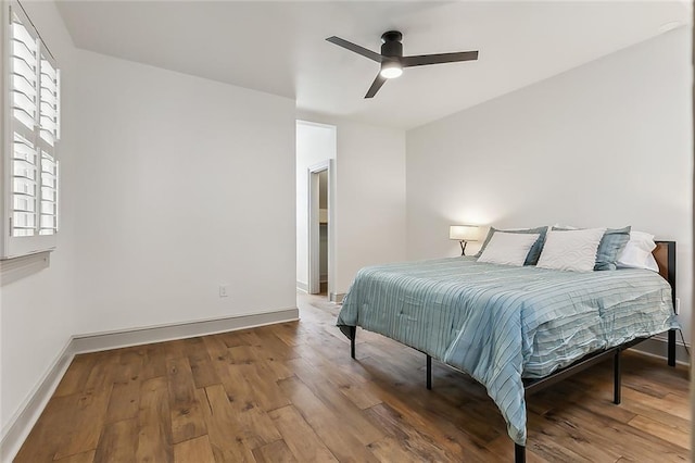 bedroom with ceiling fan and hardwood / wood-style floors