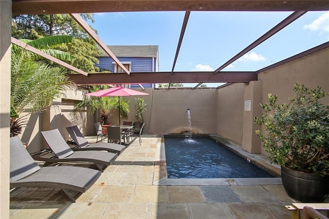 view of patio / terrace featuring pool water feature