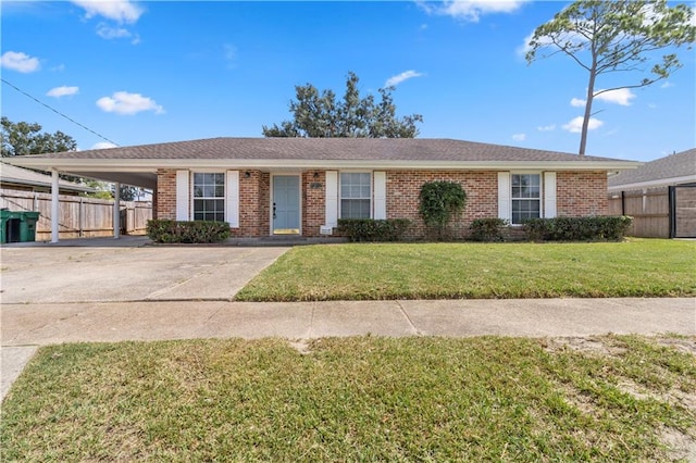 ranch-style house with a carport and a front lawn