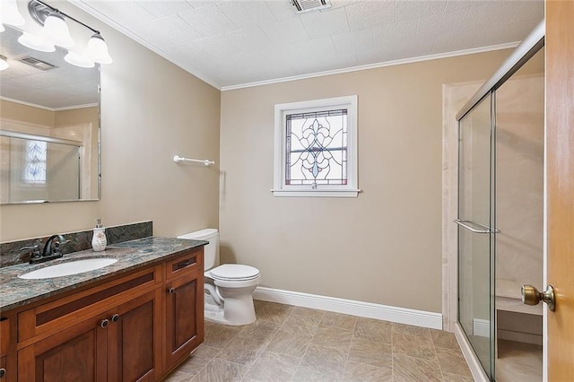 bathroom with ornamental molding, vanity, a shower with shower door, and toilet