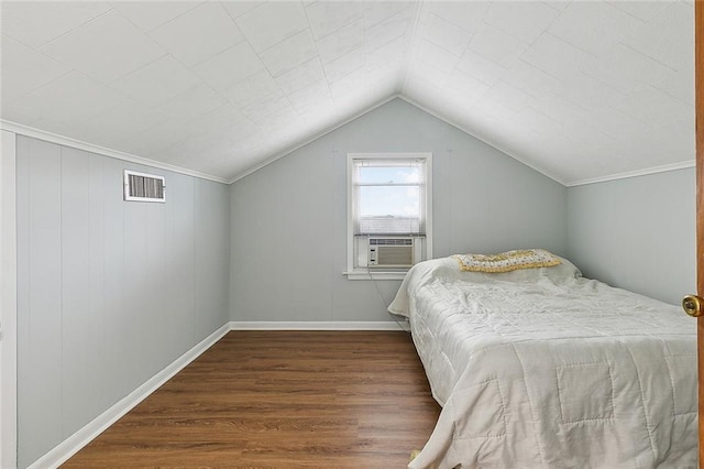 bedroom with lofted ceiling and dark hardwood / wood-style floors