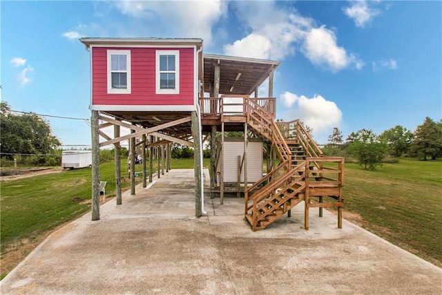 view of play area featuring a deck and a lawn