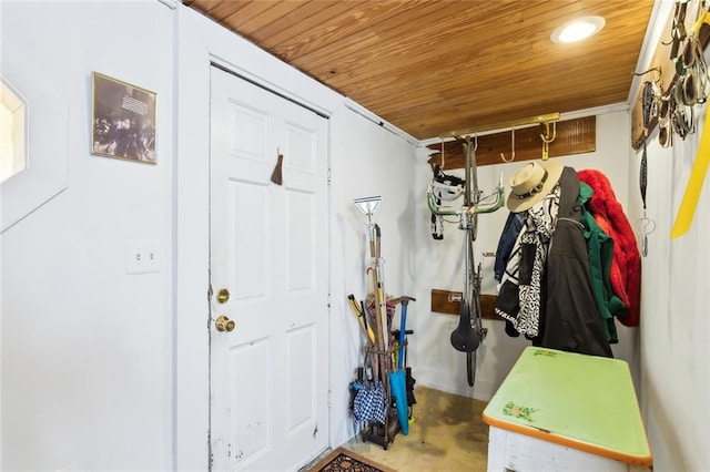 mudroom with concrete floors and wooden ceiling