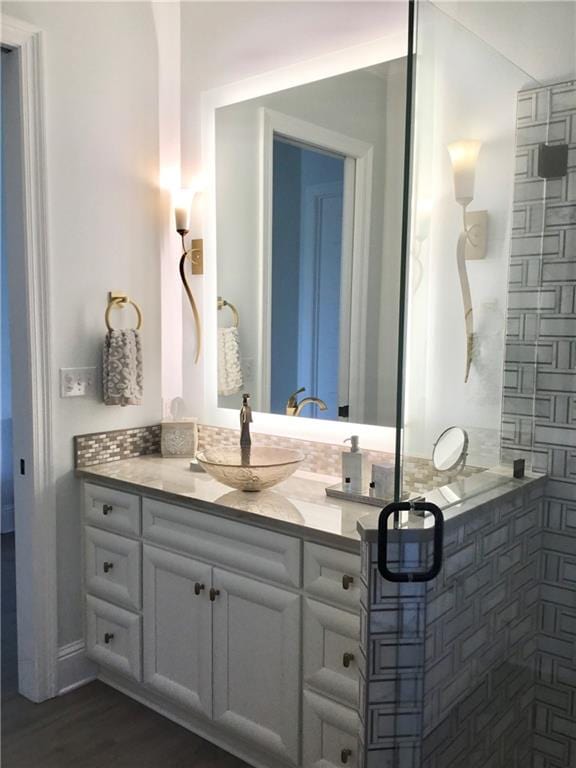 bathroom featuring wood-type flooring and vanity