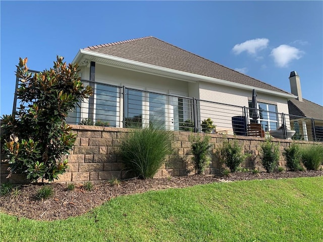 view of home's exterior with a yard