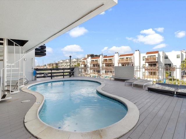 view of swimming pool featuring a deck