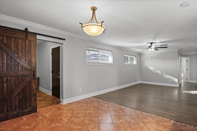 2016 Pelitere Cv, Chalmette, LA 70043 - below grade area with a barn door, baseboards, ornamental molding, and a ceiling fan