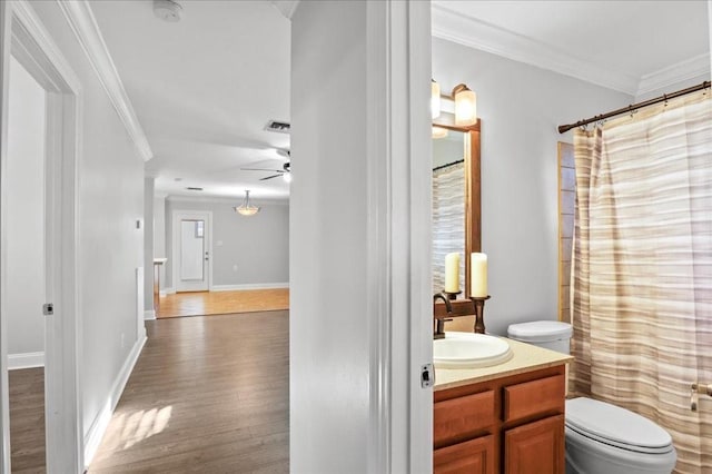 2016 Pelitere Cv, Chalmette, LA 70043 - full bathroom with ornamental molding, toilet, vanity, and wood finished floors